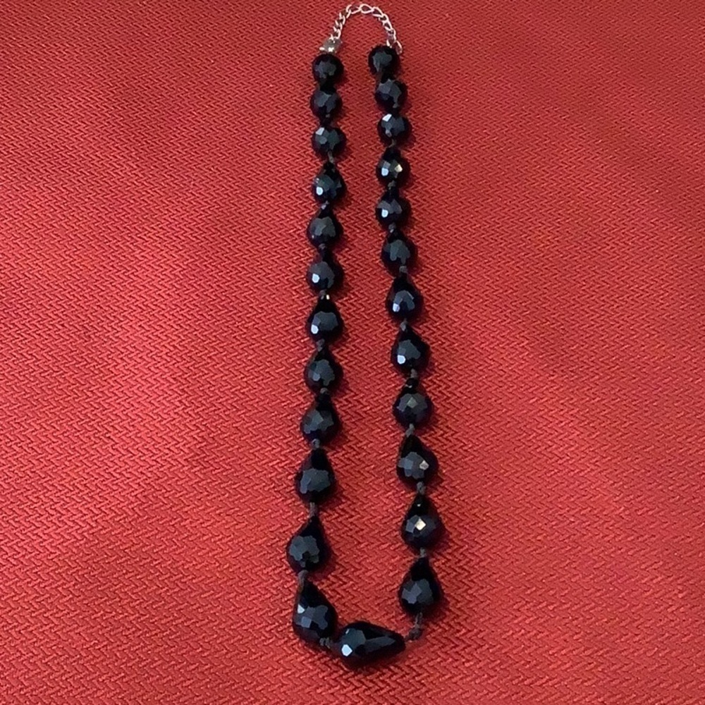Black beaded necklace 16 inch extends to 20 inch. Lobster claw closure costume